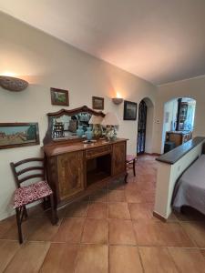 a bedroom with a desk and a bed and a chair at Casa vacanze Selene in Bolsena