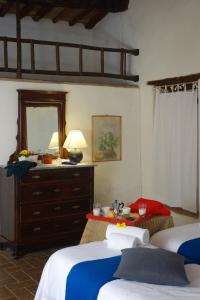 A bed or beds in a room at Fattoria Casa Sola