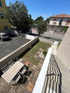 a view of a balcony with chairs and a yard at Summer Nest in Cecina