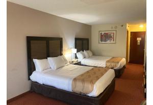 a hotel room with two beds in a room at Motel 6 Elkhart, IN in Elkhart +24 photos