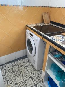 a laundry room with a washing machine in it at El Doblao del Rey in Torrejón del Rey