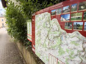 a large map on the side of a wall at Cozy Cottage - Authentic apartment in Mullerthal in Waldbillig