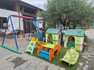 a group of childrens play equipment in a yard at Cascina Tesoriera in Santhià