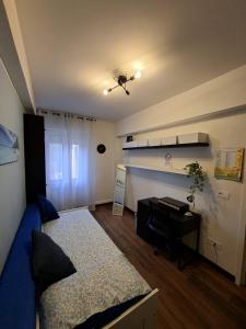 a bedroom with a bed and a desk in it at Home G & D in Monza