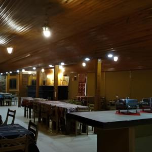a large room with tables and chairs and lights at elwaharesort in Wāsiţ +57 photos