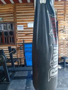 a large black punching bag sitting in a gym at Casacapuba Jacaraipe Es in Serra