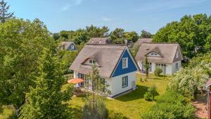 an aerial view of a house with a blue roof at Traumgarten Traumzeit in Prerow