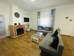 a living room with a couch and a fireplace at Villa Mia in Marchena