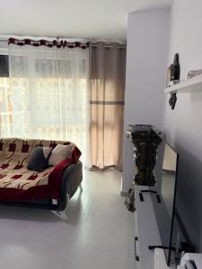 a bedroom with a bed and a window at Luxurious seaside apartment in Sakës