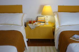 A bed or beds in a room at Fattoria Casa Sola