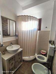 a bathroom with a sink and a shower and a toilet at La tenuta di Greta in Canino +17 photos