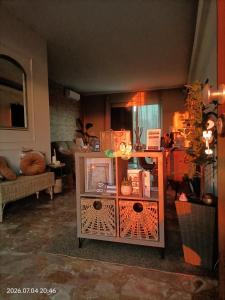 a living room with a table with boxes on it at La tenuta di Greta in Canino