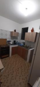 an empty kitchen with at Au D LOCATION in Grand-Bourg