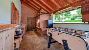 a kitchen with a stove and a large window at Villa Dobrenic by Villas Guide in Donje Taborište