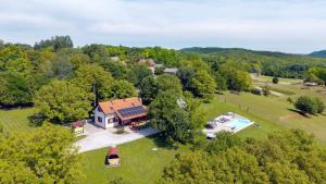 an aerial view of a house with a swimming pool at Villa Dobrenic by Villas Guide in Donje Taborište