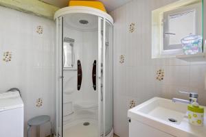 a bathroom with a shower and a toilet and a sink at Gîte Mélany in Chargé +15 photos