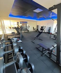a gym with several exercise equipment in a room at Westfit Barreto 01 in Mossoró
