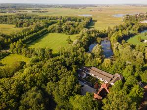 an aerial view of a house next to a river at Hotel Heemskerk in Heemskerk +58 photos