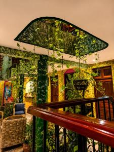 a room with a wall covered in plants at Kaa Zihil Hotel in Playa del Carmen