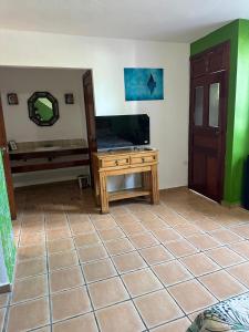 a room with a table and a mirror on the wall at Kaa Zihil Hotel in Playa del Carmen +16 photos