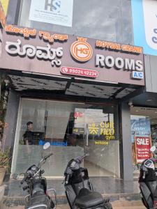 two motorcycles parked in front of a store at Hoysal Grand in Bangalore