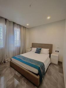 a bedroom with a large bed in a room at ANMAN HHBB tourism & business rooms in Padova