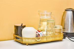 a gold tray with various items on a counter at Kalahari in Sekoma