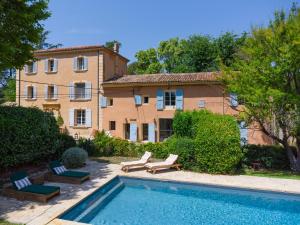 a house with a swimming pool in front of a building at Contemporary bastide in Aix in Aix-en-Provence