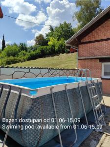 a swimming pool in front of a house at House 33 in Stari Slankamen +60 photos