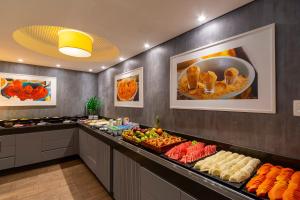a buffet line with many different types of food at Intercity Salvador in Salvador +34 photos