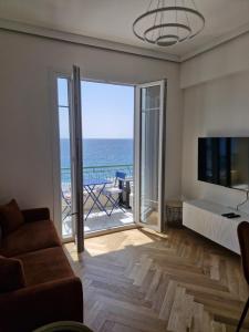 a living room with a view of the ocean at Azur Pearl - Luxury Sea View Apartement - La plage à vos pieds in Nice