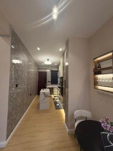 a living room with a kitchen and a dining room at TC luxury home in Lekki