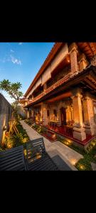 a building with a bench in front of it at Uma Kutuh Bungalow in Ubud