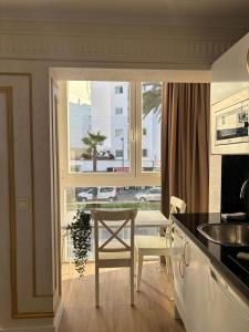 a kitchen with a table and a view of a street at Costa Marbella Star Light in Marbella