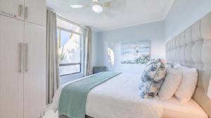 a bedroom with a bed and a window at Breakers Resort 130 Umhlanga Beachfront in Durban +15 photos