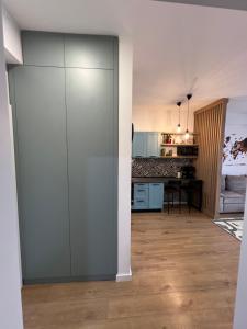 a living room with a sliding door to a kitchen at Doce Refugio in Bar +6 photos