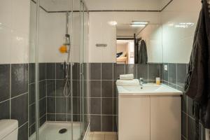 a bathroom with a shower and a sink and a toilet at Plage Centrale in Soorts-Hossegor +68 photos