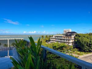 a view of the ocean from the balcony of a resort at Way Bossa in João Pessoa