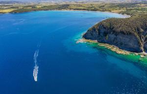 an aerial view of a boat in a large body of water at Excelsior - Venturina Terme in Venturina Terme