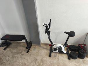 a room with a treadmill and a exercise bike at Ora Apartment in Kastel Sucurac