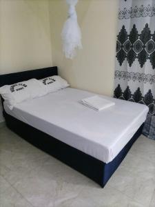 a bed in a room with a laptop on it at Mtomo vision in Mtwapa