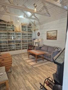 a living room with a couch and a table at lillstugan in Avesta