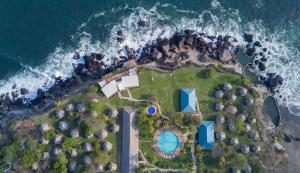 an aerial view of a house on the ocean at Atami Escape Resort in La Libertad