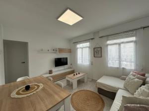a living room with a couch and a table at SotQui Cedeira in Cedeira