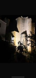 a building that is lit up at night at Casa Abuela Dolores in Setenil