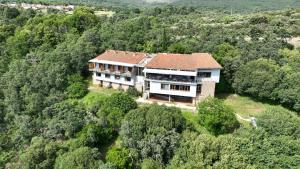 an aerial view of a house in the forest at Hotel Rural Porta Coeli - Dehesa Santa Lucía in San Martín del Castañar