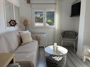 a living room with a couch and a table at R2R - Casa Gatu - 307A in Cudillero
