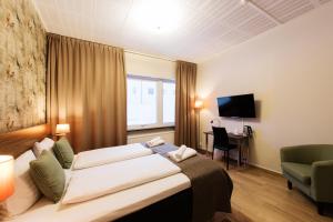 Postel nebo postele na pokoji v ubytování SPiS Hotell Naran