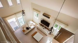 an overhead view of a living room with a couch and a tv at Villa Peri Luxury Pool Villa in Karşıyaka in Nicosia
