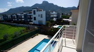 a balcony with a view of the mountains at Villa Peri Luxury Pool Villa in Karşıyaka in Nicosia